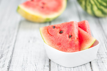 Portion of Fresh Watermelon on wooden background (selective focus).
