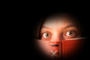 scared girl with a book