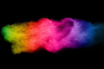 abstract color powder explosion on  black background.abstract color powder splatted on black...