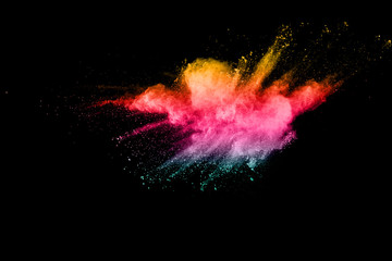 abstract color powder explosion on  black background.abstract color powder splatted on black...