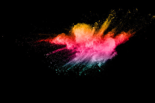 abstract color powder explosion on  black background.abstract color powder splatted on black background. Freeze motion of color powder exploding.