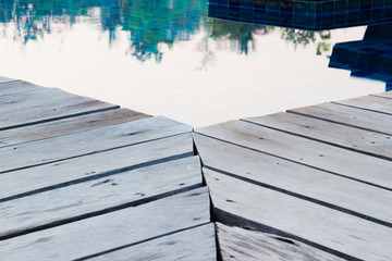 corner of wood floor near swimming pool, perspective view