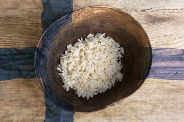 Poverty concept, bowl of rice with Finland flag