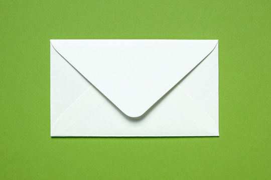 white envelope on green background