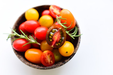 Multicolored tomatoes on a bowl