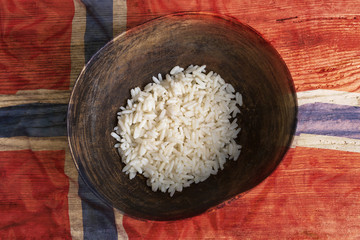Poverty concept, bowl of rice with Norway flag