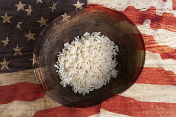 Poverty concept, bowl of rice with USA flag
