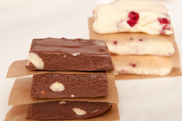 Chocolate fudge brown and white on a white background, with space for text