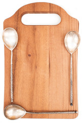 Wooden Board with spoons on white background