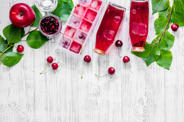 Cranberry morse with apple and pulm on wooden table background top view copyspace © 9dreamstudio
