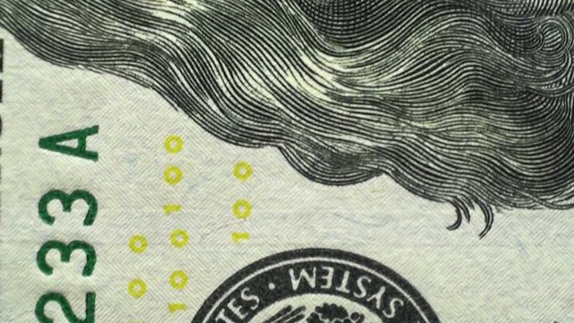 Macro view of a hundred dollar bills. Camera movement on a banknote. US dollars background. HD 1920x1080 Video Clip