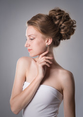 Fototapeta premium Beautiful slender girl with hairstyle