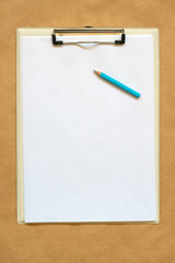 Pencil, clipboard and note paper as copy space