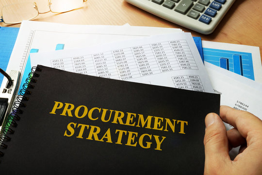 Procurement Strategy Written On A Front Of Note.