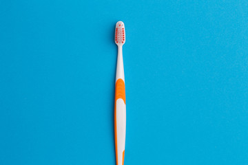 Photo of one orange toothbrush
