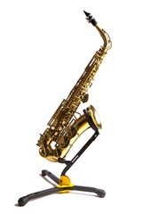 Saxophone. It is on the stand. on a white background.