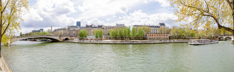 anoramic view of the Seine river in Paris and old historic buildings on the back in this wonderful European city