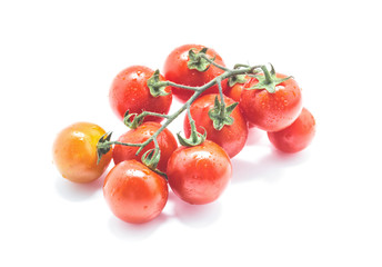 Bunch of cherry tomatoes isolated on white background