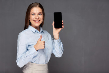 woman giving thumb up presenting smart phone