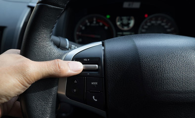 Multiple controls button on steering wheel