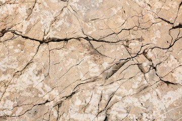 Stone cracked wall texture. Stone background. Cracks in the stone.