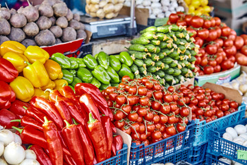market with various colorful fresh fruits and vegetables