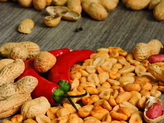 Peanuts with spices and chili. Peanut in the shell. Fresh chilli peppers. Macro.