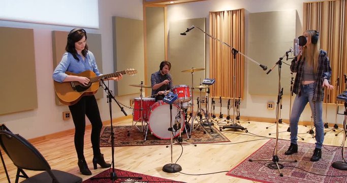 Music band performing in a studio