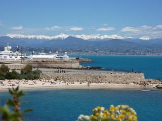 Beach, yacht boats, harbor, mountains and sea in Antibes Cote d'Azur French Riviera France
