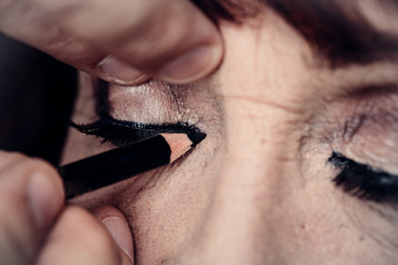 Eyeliner and make-up for grandmother, old woman, beauty for the older generation. Makeup for the...
