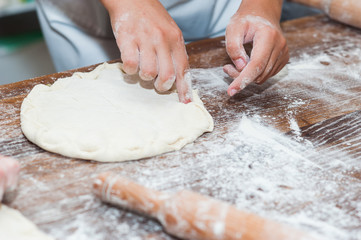 Manufacture of dough products. Hands close up