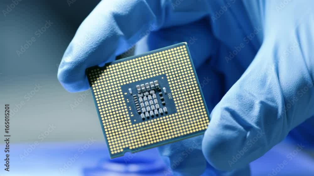 Poster close-up presentation of a new generation microchip. gloved hand holding piece of technological wond