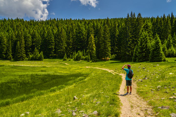 A tourist on a path in Durmitor