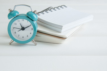 Notebooks on white wooden background