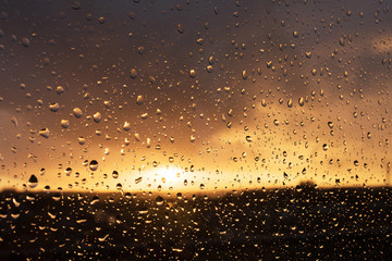 Sunset through window with Raindrops