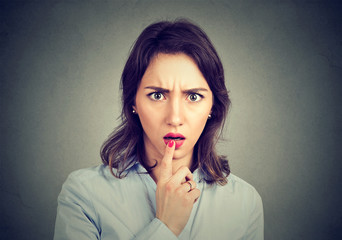 Amazed scared woman looking at camera