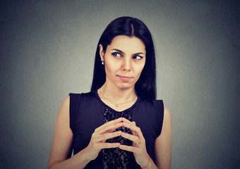 Sly, scheming woman plotting something
