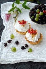Delicious cakes with cream and berries 