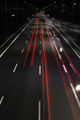 Long exposure of traffic cars lights at night on a highway