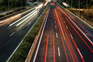 Long exposure of traffic cars lights at night on a highway