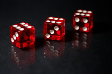 Red Sic Bo gambling dice with black isolated background