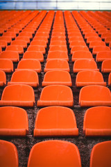 Naklejka premium Seats in the stadium red