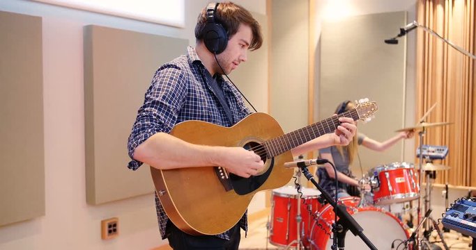 Music band performing in a studio