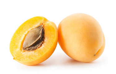 Apricots or peaches isolated on white background