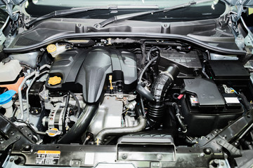 Fototapeta na wymiar Close up detail of new car engine. Clean new car engine.
