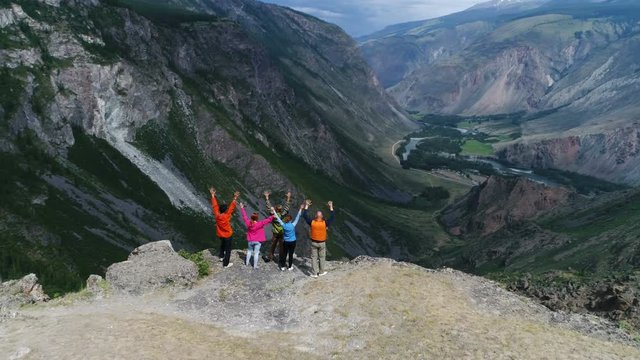 Successful Group of Happy Friends on Mountain Top, Caerial slow motion 4k.