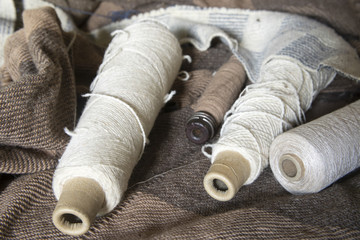 Bobbins of yarn on blanket