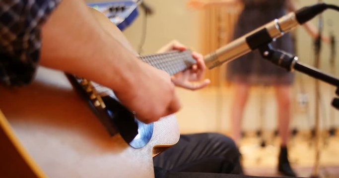 Music band performing in a studio