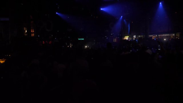People dancing on the biggest dance floor in europe, in a nightclub
