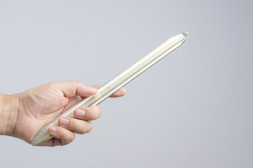 Hand holding steel tyre lever tool for changing car or bike wheel